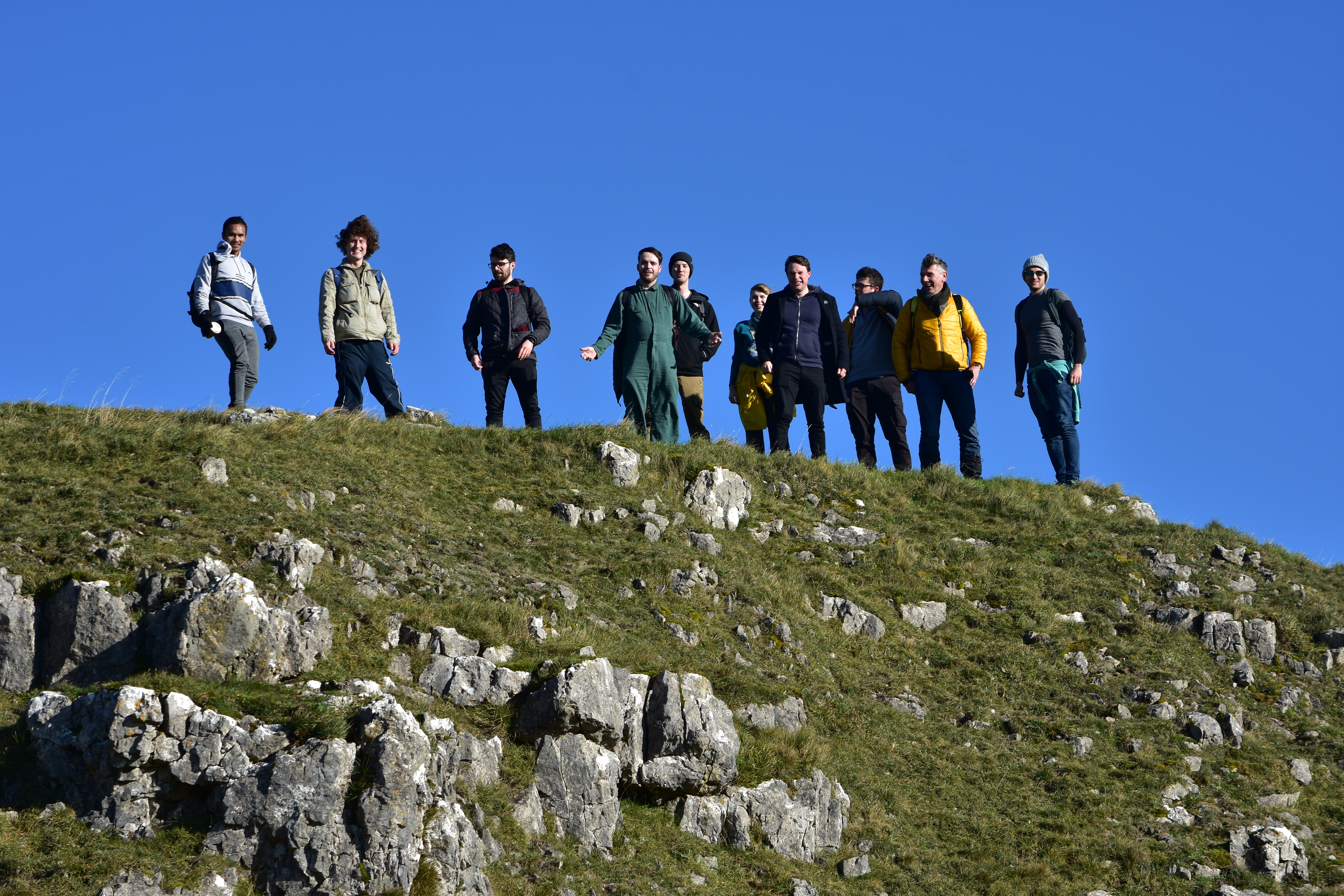 Part of the Fairlamb group on top of a hill at Malham Cove, 2023.